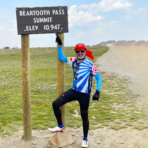 professional cyclist using moonsaddle seat at beartooth pass on cross country bike ride